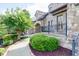 Beautifully landscaped walkway with lush greenery leading to the home's entrance at 9695 Almaviva Dr, Alpharetta, GA 30022
