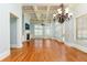 Spacious living room boasts hardwood floors, coffered ceiling, fireplace, and an abundance of natural light at 9695 Almaviva Dr, Alpharetta, GA 30022