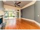 Inviting living room with fireplace, hardwood floors, and sliding doors to outdoor space at 9695 Almaviva Dr, Alpharetta, GA 30022