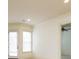 Bright, neutral living room with recessed lighting, ceiling fan, and lots of natural light at 9695 Almaviva Dr, Alpharetta, GA 30022