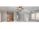 Open-concept living space with a kitchenette, natural light, and neutral paint at 9695 Almaviva Dr, Alpharetta, GA 30022