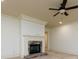 Cozy living room featuring a stone fireplace, ceiling fan, and recessed lighting at 9695 Almaviva Dr, Alpharetta, GA 30022