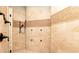 Luxurious walk-in shower with rainfall showerhead, bench and tile surround at 9695 Almaviva Dr, Alpharetta, GA 30022
