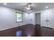 Bedroom with hardwood floors, ceiling fan, and ample closet space with double doors at 1393 Sagewood Cir, Stone Mountain, GA 30083
