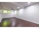 This bedroom features hardwood floors, a ceiling fan, and a bright window at 1393 Sagewood Cir, Stone Mountain, GA 30083