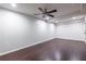 Spacious bedroom featuring hardwood floors, neutral paint, and a ceiling fan at 1393 Sagewood Cir, Stone Mountain, GA 30083