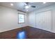 Bedroom with hardwood floors, ceiling fan, and a double door closet at 1393 Sagewood Cir, Stone Mountain, GA 30083