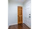A classic hallway featuring two doors and dark hardwood floors at 1393 Sagewood Cir, Stone Mountain, GA 30083
