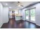 Kitchen with backyard view and white cabinetry complemented by hardwood floors and stainless steel appliances at 1393 Sagewood Cir, Stone Mountain, GA 30083