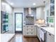 Charming kitchen boasting stainless steel appliances, subway tile backsplash, and natural light at 1393 Sagewood Cir, Stone Mountain, GA 30083