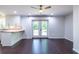 Kitchen with backyard view from French doors has white cabinets, breakfast bar, and dark hardwood floors at 1393 Sagewood Cir, Stone Mountain, GA 30083