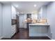 Well-equipped kitchen featuring stainless steel appliances, a breakfast bar, and lots of sleek white cabinets at 1393 Sagewood Cir, Stone Mountain, GA 30083