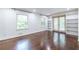 Bright room with hardwood floors, large windows, and built-in bookshelves at 1393 Sagewood Cir, Stone Mountain, GA 30083