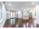 Open-concept living area with hardwood floors, built-in bookshelves, and abundant natural light at 1393 Sagewood Cir, Stone Mountain, GA 30083