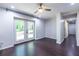 Bright room with hardwood floors and French doors leading to a backyard view and hallway to bedrooms at 1393 Sagewood Cir, Stone Mountain, GA 30083