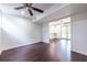 Bright living room with hardwood floors that leads to a modern kitchen and French doors to backyard at 1393 Sagewood Cir, Stone Mountain, GA 30083