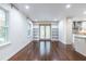 Bright living room with hardwood floors, built-in bookshelves, and large windows at 1393 Sagewood Cir, Stone Mountain, GA 30083