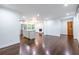 Spacious living area featuring hardwood floors, a kitchen island, and an elegant fireplace at 1393 Sagewood Cir, Stone Mountain, GA 30083