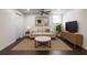 Cozy living room with a modern sofa, coffee table, and entertainment unit at 1393 Sagewood Cir, Stone Mountain, GA 30083