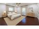 Serene main bedroom with neutral decor, plush bedding, hardwood floors, and natural lighting at 1393 Sagewood Cir, Stone Mountain, GA 30083