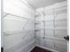 Walk-in pantry features many levels of shelving that would make storage easy and convenient at 1393 Sagewood Cir, Stone Mountain, GA 30083