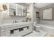 Well-lit bathroom featuring double vanity, soaking tub, and modern fixtures at 1820 Peachtree Nw St # 804, Atlanta, GA 30309