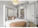 Bedroom featuring a space-saving murphy bed, closet space and a bathroom just off the bedroom at 1820 Peachtree Nw St # 804, Atlanta, GA 30309