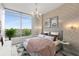 Serene bedroom with large windows, patterned wallpaper, chandelier and natural light at 1820 Peachtree Nw St # 804, Atlanta, GA 30309
