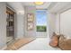 This bedroom features natural light from the large window and a walk out balcony at 1820 Peachtree Nw St # 804, Atlanta, GA 30309