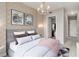 Bedroom with walk-in closet, elegant decor, and stylish ceiling light fixture at 1820 Peachtree Nw St # 804, Atlanta, GA 30309