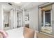 Bedroom featuring a space-saving murphy bed, ensuite bathroom and balcony access at 1820 Peachtree Nw St # 804, Atlanta, GA 30309