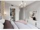 Modern bedroom featuring a walk-in closet, stylish lighting, and elegant decor at 1820 Peachtree Nw St # 804, Atlanta, GA 30309