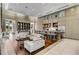 Open clubhouse area with a kitchen, bar seating, comfortable armchairs, and bright natural light at 1820 Peachtree Nw St # 804, Atlanta, GA 30309