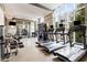 Bright fitness center with treadmills, weight machines, and a mirror wall, perfect for a workout at 1820 Peachtree Nw St # 804, Atlanta, GA 30309