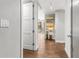 Hallway leading to the living area with wood floors and decorative artwork at 1820 Peachtree Nw St # 804, Atlanta, GA 30309