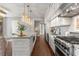 Modern kitchen featuring stainless steel appliances, a gas range, and a large island with bar stool seating at 1820 Peachtree Nw St # 804, Atlanta, GA 30309