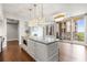 Stylish kitchen with an island, stainless steel appliances, and direct access to an outdoor balcony at 1820 Peachtree Nw St # 804, Atlanta, GA 30309