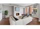 Warm living room featuring a fireplace with an elegant tile surround and comfortable seating area at 1820 Peachtree Nw St # 804, Atlanta, GA 30309