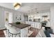 Open concept living and dining area with hardwood floors, chandelier, and bar stool seating at 1820 Peachtree Nw St # 804, Atlanta, GA 30309