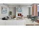 Cozy living room featuring a fireplace with an elegant tile surround and large windows at 1820 Peachtree Nw St # 804, Atlanta, GA 30309