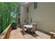 Enjoy the wooded view on the spacious back deck, perfect for outdoor dining and entertaining at 2045 Barrett Downs Dr, Cumming, GA 30040
