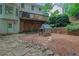 Enjoy the lush, wooded backyard with a charming playhouse and private patio area at 2045 Barrett Downs Dr, Cumming, GA 30040