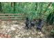 Unwind by the firepit on the stone patio in the private, wooded backyard at 2045 Barrett Downs Dr, Cumming, GA 30040