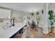 Bright kitchen with an island, stainless steel appliances, and an adjacent breakfast area with natural light at 2045 Barrett Downs Dr, Cumming, GA 30040