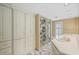 Bathroom featuring a glass-enclosed shower, double sinks, and ample storage at 2769 Peachtree Ne Rd # 7, Atlanta, GA 30305