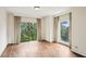 Bright bedroom with hardwood floors, balcony, and large windows with picturesque views at 2769 Peachtree Ne Rd # 7, Atlanta, GA 30305