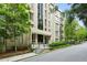 Well-maintained building featuring a landscaped entrance and mature trees surrounding the property at 2769 Peachtree Ne Rd # 7, Atlanta, GA 30305