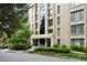 Well-maintained building featuring a landscaped entrance and manicured greenery surrounding the property at 2769 Peachtree Ne Rd # 7, Atlanta, GA 30305