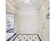 Bright foyer with tile flooring and decorative door hardware at 2769 Peachtree Ne Rd # 7, Atlanta, GA 30305