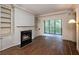 Cozy living room with fireplace, built-in shelves, and a balcony with outdoor views at 2769 Peachtree Ne Rd # 7, Atlanta, GA 30305